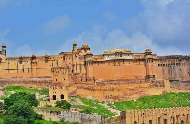 The ramparts and palace buildings of Amber Fort, Jaipur, on the hillside above Maota Lake
